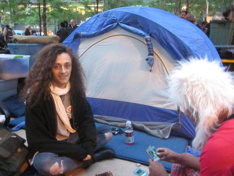 Dre DiMura near one of the many tents that have sprouted up at Zucotti Park in recent days